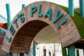 Let's Play children's playground wooden entrance sign. Royalty Free Stock Photo