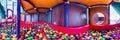 Children`s playroom with colorful balls and a slide made of plastic. . Cylindrical panorama 360