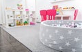 Children`s Playroom with Colorful Toys in Shelves and Ball Pool Royalty Free Stock Photo
