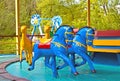 Children`s revolving carousel in the park. Horses, camels. Royalty Free Stock Photo