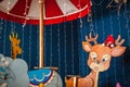 Children`s rides close-up and copy space. Children`s carousel with animals in an amusement park