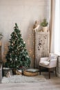 Children`s room decorated for Christmas and New Year. Christmas tree, wardrobe, armchair and ottoman