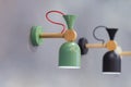 Children`s room wall lamp, original lamp with a green lampshade made of metall. Subdued light in the children`s bedroom