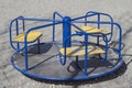 Children's roundabout (merry-go-round) on the playground. Royalty Free Stock Photo