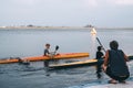 Children`s rowing training on the river, learn how to row the kayak