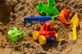 Children`s sandbox on the playground for games with toys for children by truck, car, excavator, sand dressers with a spatula Royalty Free Stock Photo