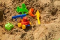 Children`s sandbox on the playground for games with toys for children by truck, car, excavator, sand dressers with a spatula Royalty Free Stock Photo