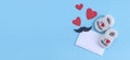 Children`s shoes, an envelope and hearts with a mustache on blue. Royalty Free Stock Photo