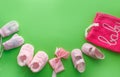 Children`s shoes on a green background top view. space for the text. children`s slippers Royalty Free Stock Photo