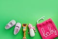 Children`s shoes on a green background top view. space for the text. children`s slippers Royalty Free Stock Photo