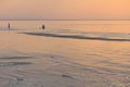 Children`s silhouettes at sunset at sea.