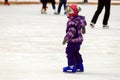 Children s skate rink. A little boy skates in the winter. Active family sport , the winter holidays and the cold season.School Royalty Free Stock Photo