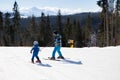 Children\'s skiing lesson at ski school. Seasonal joys, happy childhood. Frosty weather Royalty Free Stock Photo