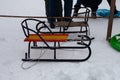 Children`s sledges in the snow.
