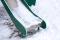Children's slide in the snow close up Royalty Free Stock Photo