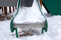 Children's slide in the snow close up Royalty Free Stock Photo