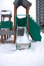 Children's slide in the snow close up Royalty Free Stock Photo