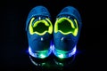 Children`s sneaker shoes with led light illumination