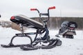 A children\'s snowmobile is ready for children to ride in the snow Royalty Free Stock Photo