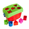 A children`s sorter toy, a puzzle for sorting figures into appropriate holes, isolated on a white