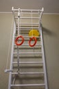 Children`s sports complex. Baby sports wall. Ladders, sports rings Royalty Free Stock Photo