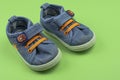 Children`s sports shoes. A pair of children`s shoes on a green background. Children`s sneakers