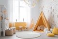 Children\'s stylish room, cozy and creative space, decorated with colorful decor, wigwam and trendy furniture