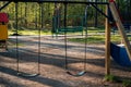 Children`s swing in the park Royalty Free Stock Photo