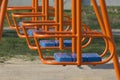 Children`s swings in the yard. Sport and physical development of children Royalty Free Stock Photo