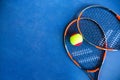 Children's Tennis ball and Tennis Rackets on blue background