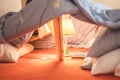 Children`s tent with duvets, with lamps and bookcases.