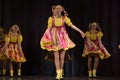 Children's theatrical performance of dance group in national costumes