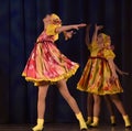 Children's theatrical performance of dance group in national costumes