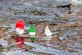 Children`s toy boats floating in water outdoors