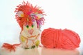 Children's toy lion hack with wool clew on white Royalty Free Stock Photo