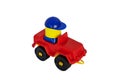 Children's toy, red plastic car with driver on white background. Royalty Free Stock Photo