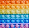 Children's toy 'simple dimple' painted in rainbow colors. Royalty Free Stock Photo