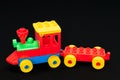 ChildrenÃ¢â¬â¢s toy train made from large building blocks with the colours red, green, blue and yellow Royalty Free Stock Photo