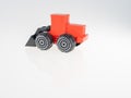 Children`s toy on a white background. Red tractor. Close-up. There is room for text Royalty Free Stock Photo