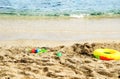 Children's toys on the beach close-up