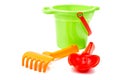 Children's toys bucket shovel and rake on the white Royalty Free Stock Photo