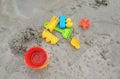 Children`s Toys on sand beach background Royalty Free Stock Photo
