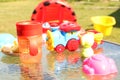 Children`s toys are in the sunlight on the table