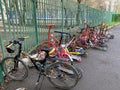 Children`s transport in the parking lot near the school, bicycles and scooters