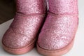 Children s warm boots with sequins, close-up, comfortable. Pink Royalty Free Stock Photo
