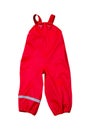 Children`s wear - Red rainpants raincoat with reflector on the leg isolated over the white background