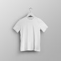 Children\'s white t-shirt template, blank shirt on hanger, front view, isolated on background Royalty Free Stock Photo