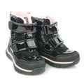 Children`s winter black boots with velcro for a little girl isolated on a white background Royalty Free Stock Photo