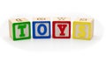 Children's wood blocks spelling the word toys over Royalty Free Stock Photo