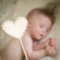 Children`s wooden tablet against the sleeping baby